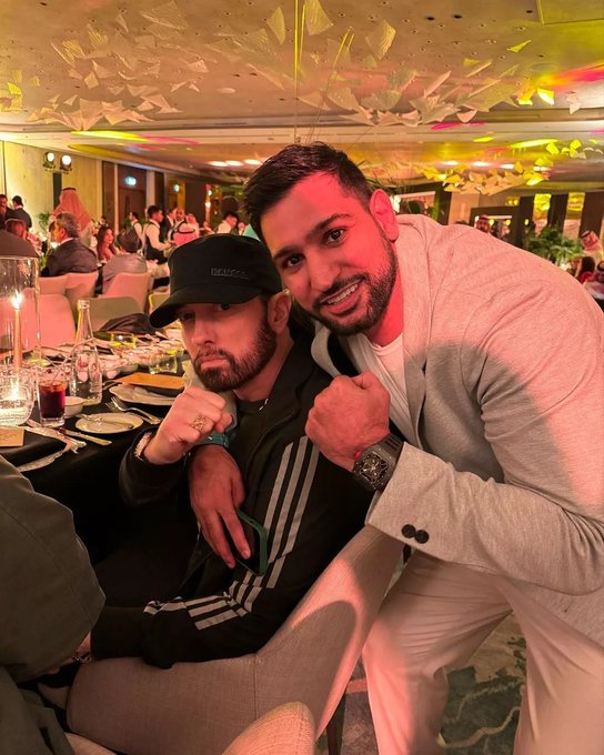 Ex-Boxing Champ Amir Khan gifts Eminem a wristwatch on their first meeting.